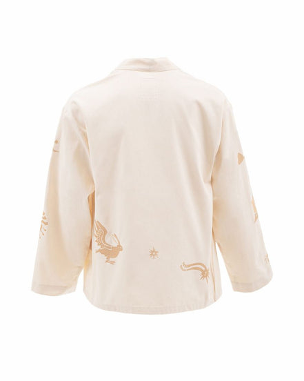 Beige cardigan with embroidered designs on a white background