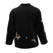 Black top with gold embroidery on a white background