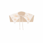Small round umbrella with floral design on a white background