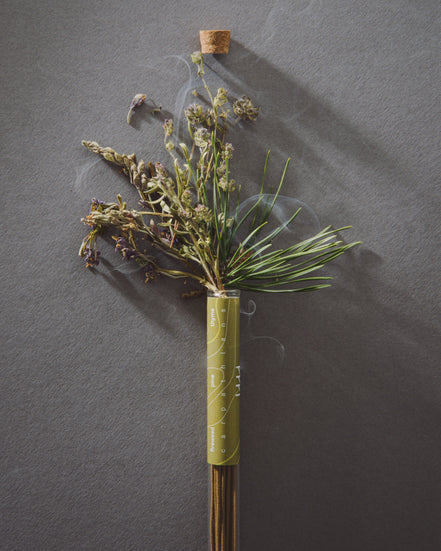 Dried floral arrangement on a dark gray background