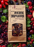 Packaged tea surrounded by a variety of colorful berries and fruits
