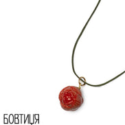 Necklace with a red pendant on a white background