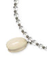Necklace with a large cream-colored bead and smaller clear beads on a white background