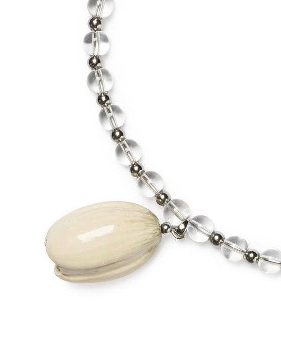 Necklace with a large cream-colored bead and smaller clear beads on a white background