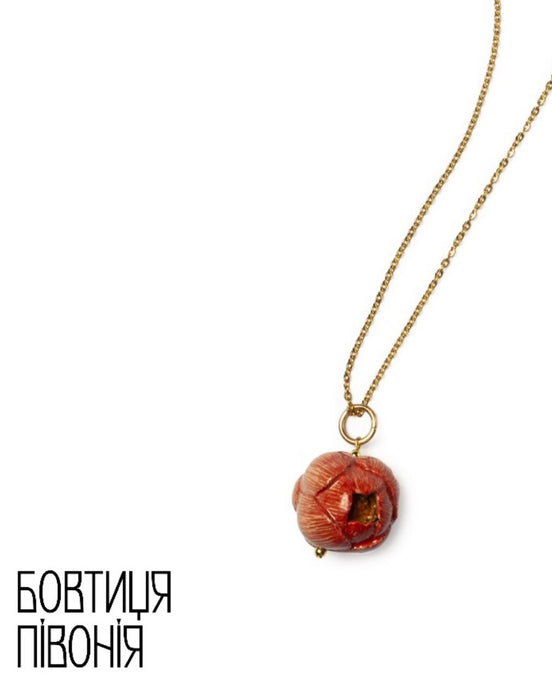 Necklace with a brown pendant on a white background